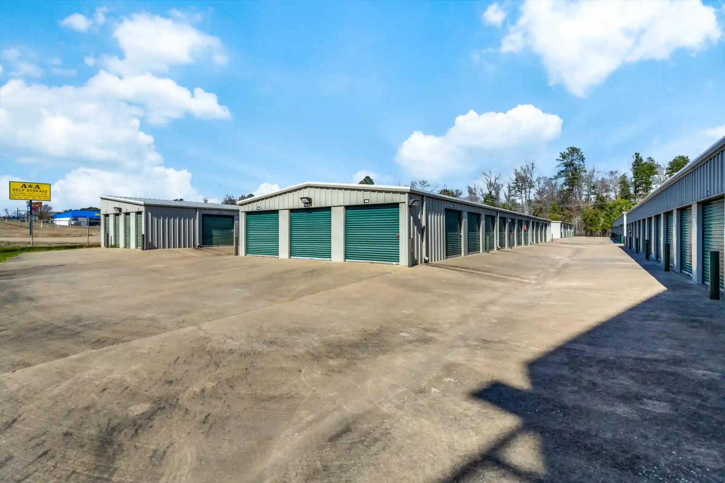 row of self storage units with drive up access and roll up doors