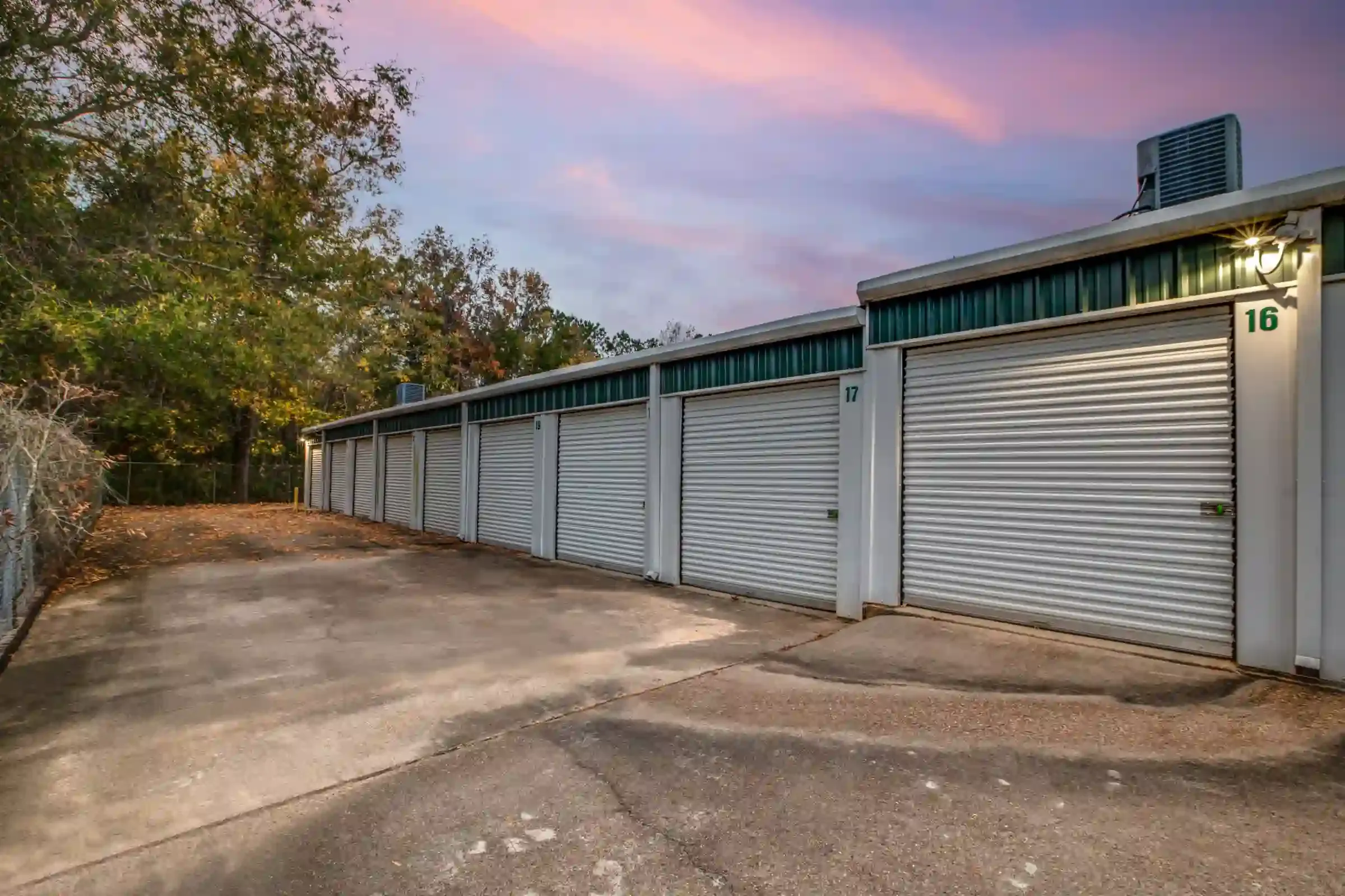 outside a storage facility with roll up doors and drive up access
