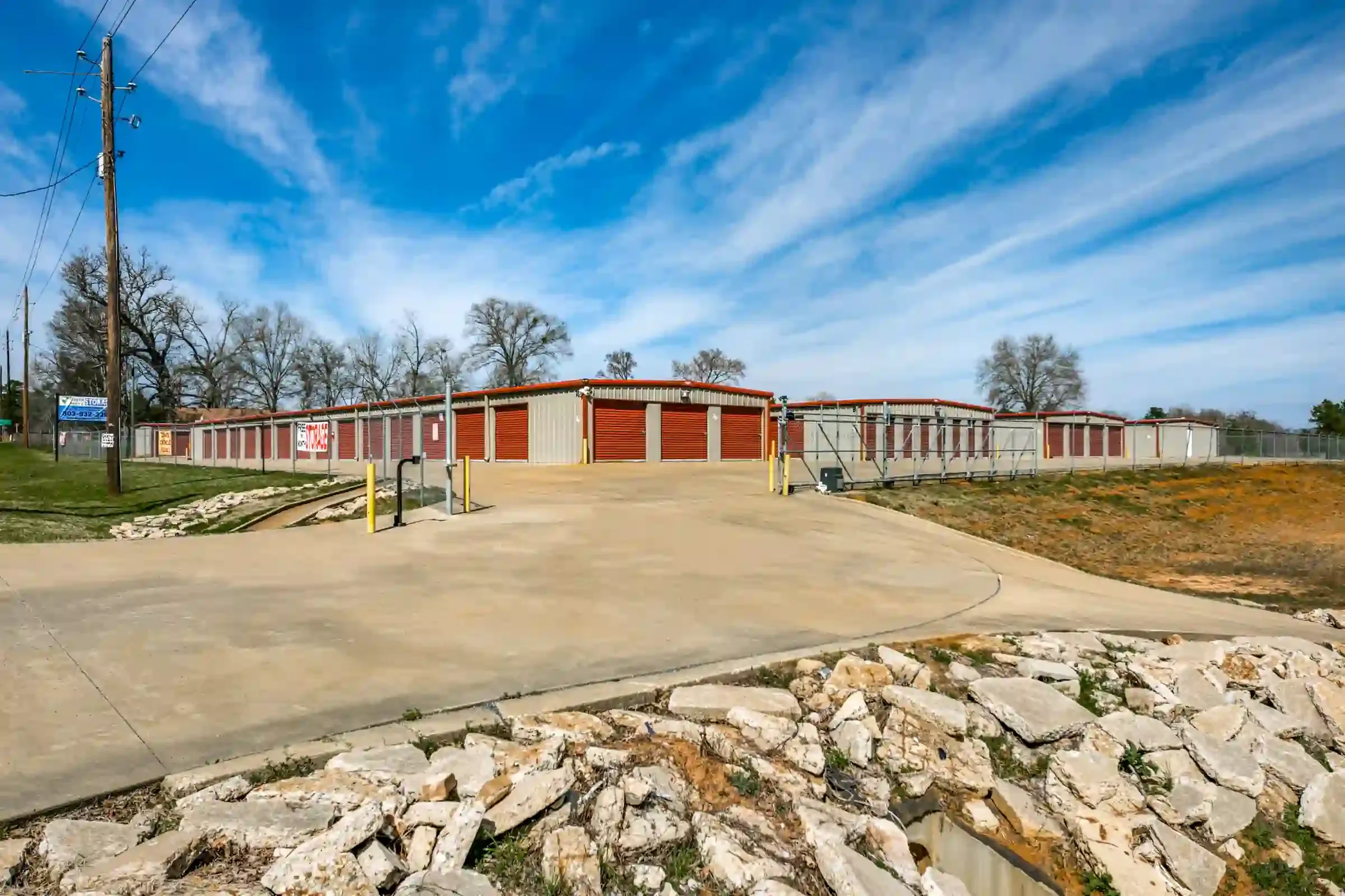 row of storage units with drive up access and gated entry