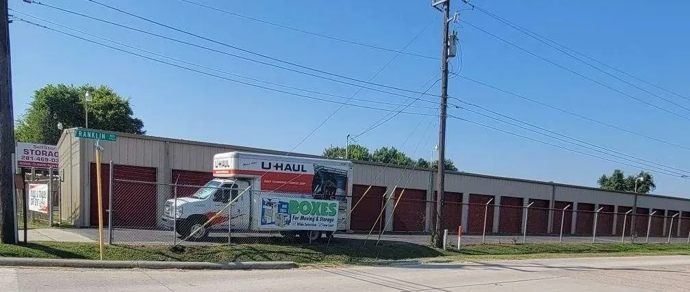uhaul truck parked next to storage units outside facility