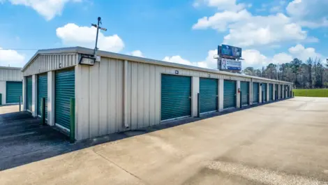 row of self storage units with drive up access and roll up doors