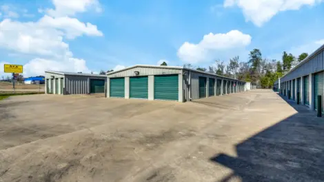 row of self storage units with drive up access and roll up doors