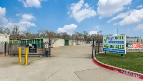 gated entry to storage facility with freedom storage signage