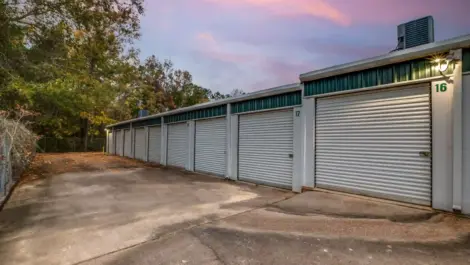 outside a storage facility with roll up doors and drive up access