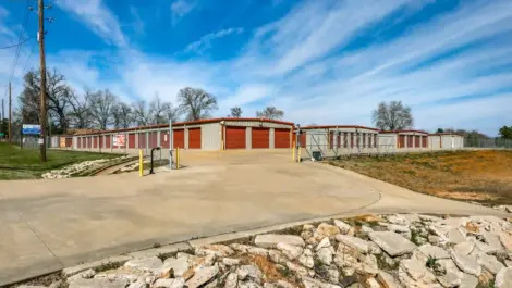 row of storage units with drive up access and gated entry