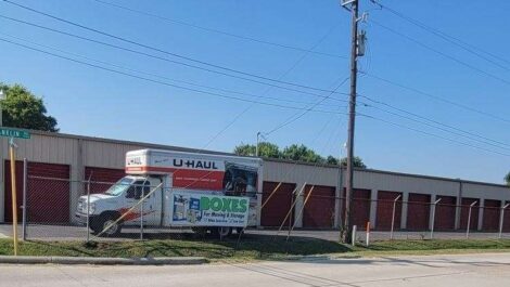 uhaul truck parked next to storage units outside facility