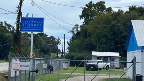 right move sign at gated entry to storage facility