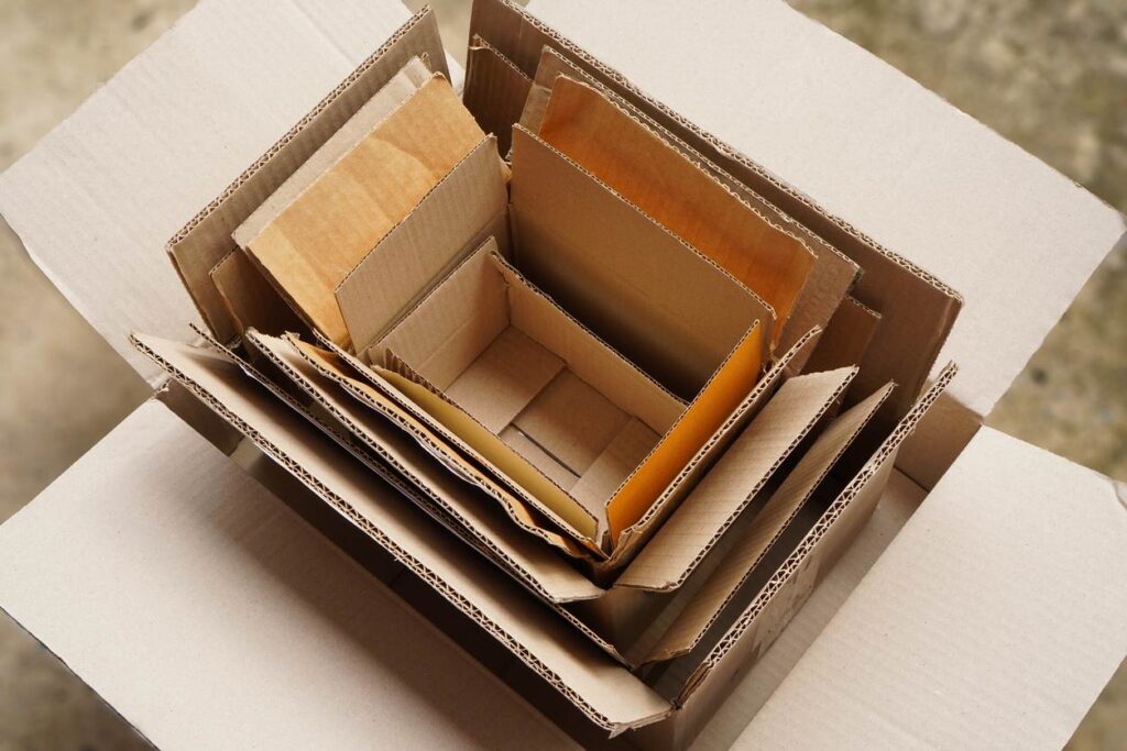 Several different sizes of cardboard boxes placed inside one another.
