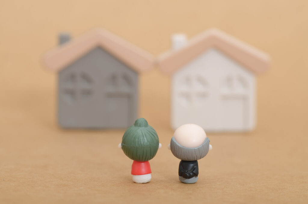 A toy model of two houses and an elderly couple to resemble retirement decisions of living spaces.